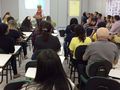 Membros do Núcleo COM-VIDA apresentam projeto escola sustentável.